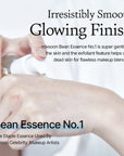 Applying Mixsoon Bean Essence to the face – Gently patting the essence into the skin for quick absorption and hydration.