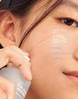 Close-up of Haruharu Wonder Black Rice Hyaluronic Essence being applied to skin, leaving it soft and smooth