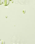 Model gently applying Beauty of Joseon Calming Serum Green Tea + Panthenol to the face, showcasing its ability to soothe, hydrate, and calm irritated skin