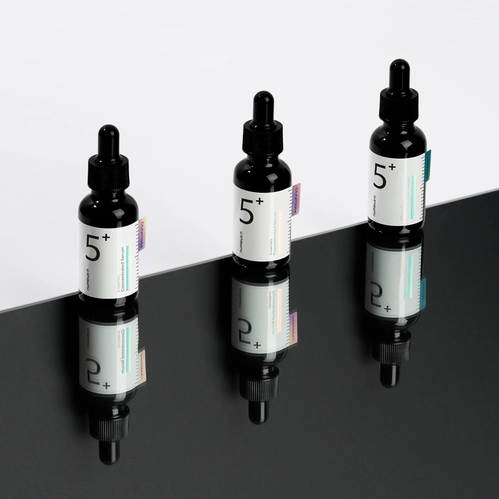 Numbuzin No.5 Vitamin Concentrated Serum (50 ml) bottle showcasing the formula with glutathione, vitamin C, and tranexamic acid to target pigmentation, dark spots, and uneven skin tone, providing a radiant, brightened complexion.