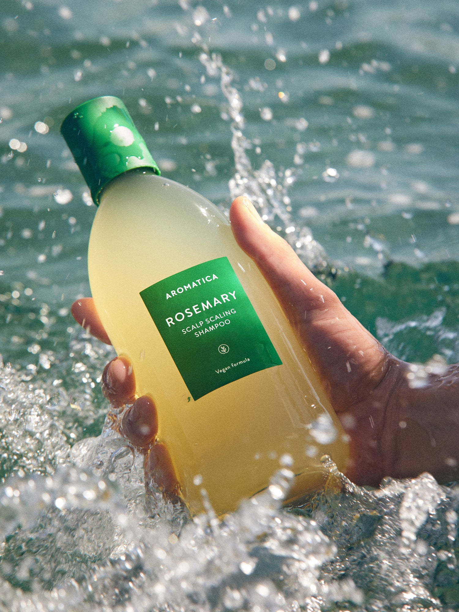 Aromatica Rosemary Scalp Scaling Shampoo gently massages into the scalp to remove buildup and restore scalp balance with soothing rosemary oil