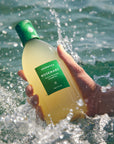 Aromatica Rosemary Scalp Scaling Shampoo gently massages into the scalp to remove buildup and restore scalp balance with soothing rosemary oil