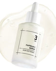 Close-up of the serum being dispensed, showing its lightweight, fast-absorbing texture without any sticky residue, emphasizing deep hydration and smooth skin.