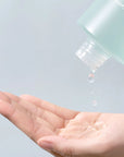 numbuzin toners Close-up of toner being applied to a cotton pad, showcasing its light, watery texture and cooling, refreshing feel, perfect for sensitive or acne-prone skin.