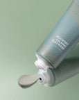Close-up of Isntree Real Mugwort Clay Mask's smooth, thick texture, ideal for exfoliating and purifying skin