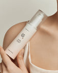 Model applying Beauty of Joseon Ginseng Moist Sun Serum to the face for deep hydration, strong sun protection, and a smooth, makeup-friendly base