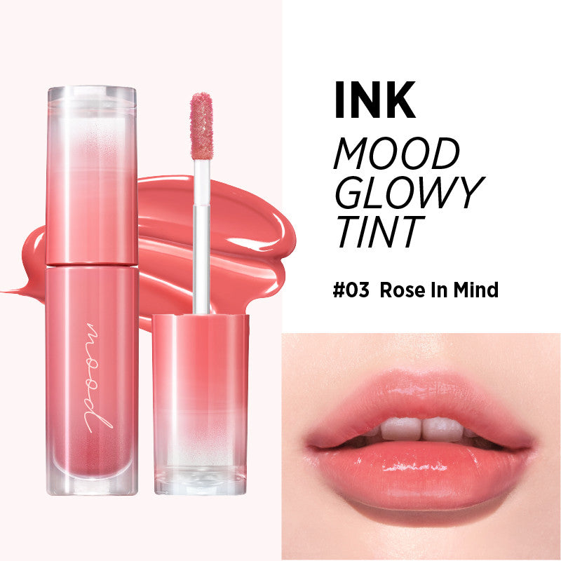 Peripera Ink Mood Glowy Tint being applied directly to the lips, starting from the center and blending outward for a smooth, even finish, highlighting its non-sticky, moisturizing texture.