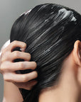 Some By Mi Cica Peptide Anti Hair Loss Derma Scalp Treatment – Applying the nourishing conditioner to damp hair to repair and hydrate, leaving it soft, shiny, and healthy-looking.