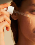 Applying Skin1004 Madagascar Centella Asiatica Ampoule – Gently patting the ampoule onto face for better absorption and hydration.