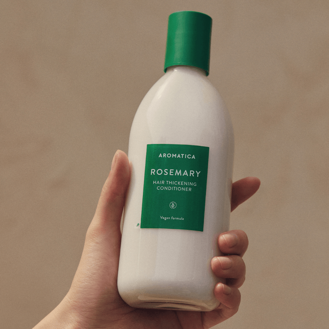 Aromatica Rosemary Hair Thickening Conditioner enriched with rosemary, bhringraj, coriander, biotin, babassu oil, and moringa oil for healthy, voluminous hair