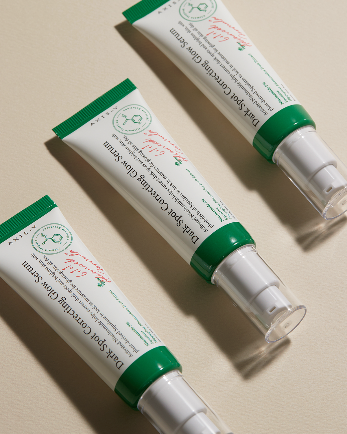 AXIS-Y Dark Spot Correcting Glow Serum: Apply a small amount to target dark spots and uneven skin tone, gently patting for absorption