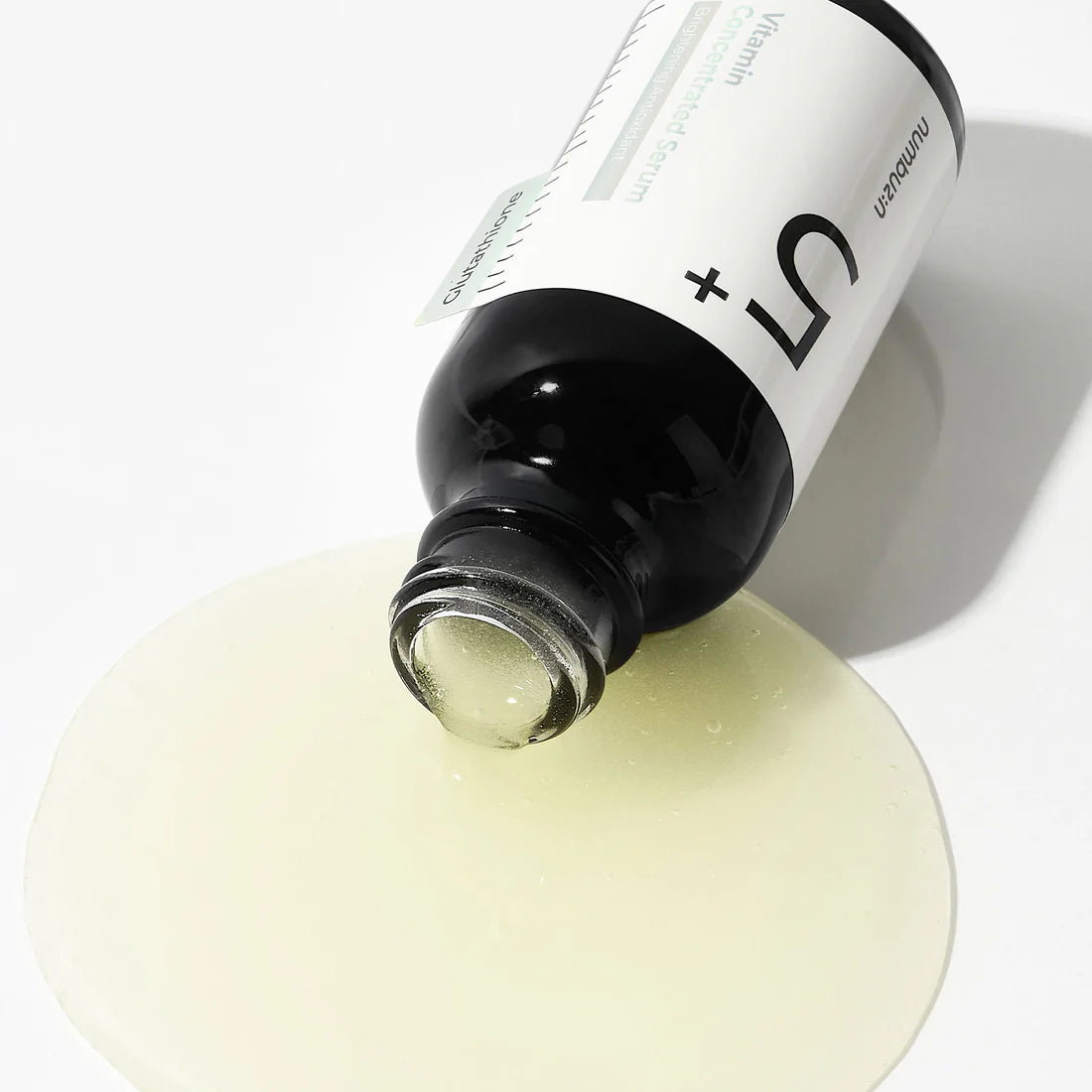 Close-up of serum being applied to the skin, showing its smooth, lightweight texture absorbing quickly, leaving no greasy residue while promoting clearer and brighter skin.