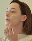 Beauty of Joseon Revive Eye Serum being gently applied to the under-eye area to reduce puffiness, wrinkles, and dark circles