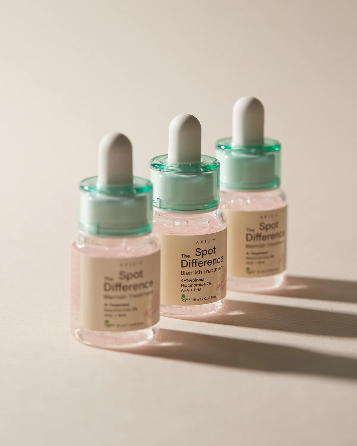 AXIS-Y Spot The Difference Blemish Treatment: 15ml bottle with a dropper for precise application of the lightweight gel, ideal for treating acne and blemishes