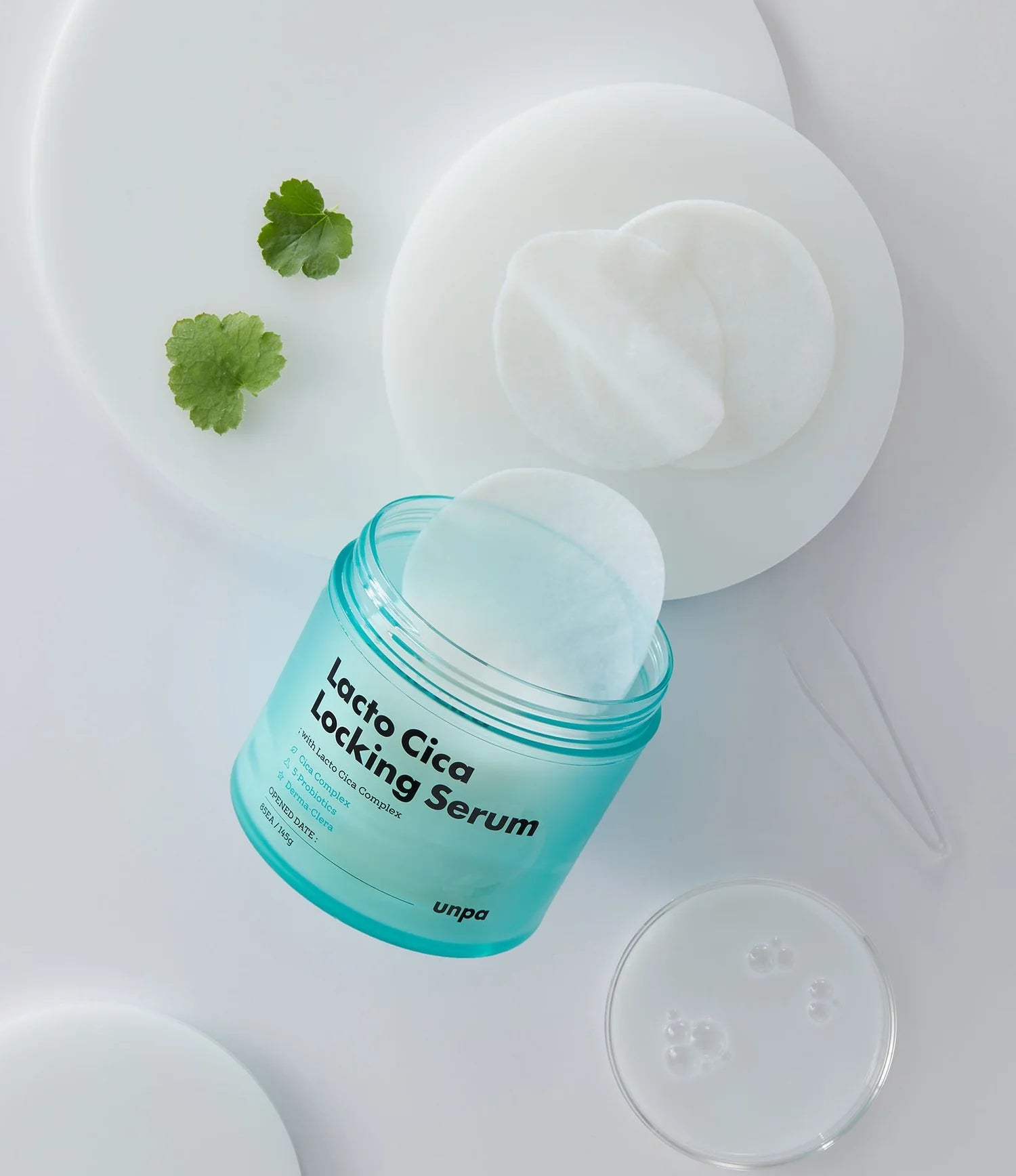 Unpa Lacto Cica Locking Serum Pads – Close-up of the serum pads soaked in a nourishing formula with Centella Asiatica, probiotics, and skin-soothing ingredients for calming irritated and sensitive skin.