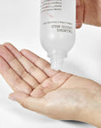 Close-up of COSRX AC Collection Calming Liquid Mild texture – Lightweight liquid essence that gently exfoliates, controls sebum, and soothes sensitive skin