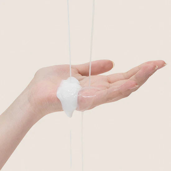 Demonstrating the application of Mary & May Vitamin C + Bifida Lotion – Lotion being massaged onto the face and neck, providing smooth and hydrated skin.