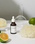 Close-up of the active ingredients, Citrus Unshiu Fruit Extract and Tremella Fuciformis Extract, illustrating their brightening and hydrating effects on the skin.