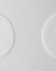 Close-up of a Mary & May Gluconolactone PHA + Betula Alba Juice Cleansing Pad – The textured side of the pad for gentle exfoliation, with a smooth side for soothing hydration.