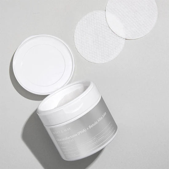 Close-up of a Mary & May Gluconolactone PHA + Betula Alba Juice Cleansing Pad – The textured side of the pad for gentle exfoliation, with a smooth side for soothing hydration.