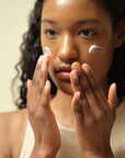Model applying The Beauty of Joseon Dynasty Cream to the face, gently patting the nourishing formula into the skin for deep hydration and a radiant, healthy glow