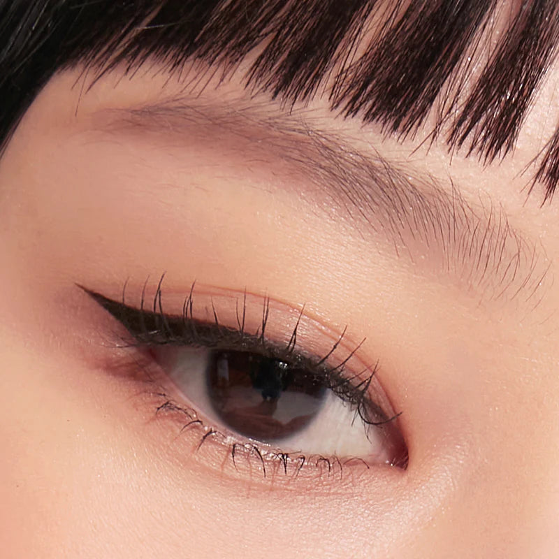 Before and after applying the Peripera Speedy Eyebrow Auto Pencil, showing how the pencil fills in sparse brows and enhances the overall shape, resulting in fuller, more defined brows.