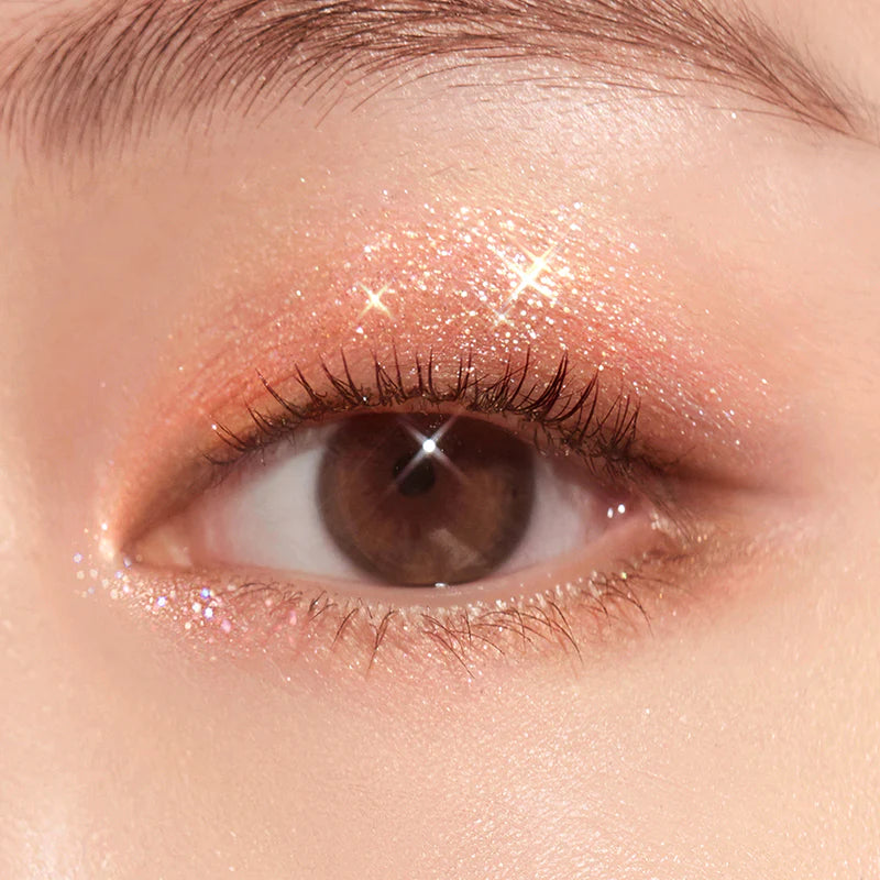 Close-up of a smoky eye makeup look created using the dark matte shades and shimmer from the Peripera All Take Mood Technique Palette, emphasizing the versatile smoky effect and the radiant finish from the shimmer.