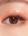 Close-up of a smoky eye makeup look created using the dark matte shades and shimmer from the Peripera All Take Mood Technique Palette, emphasizing the versatile smoky effect and the radiant finish from the shimmer.