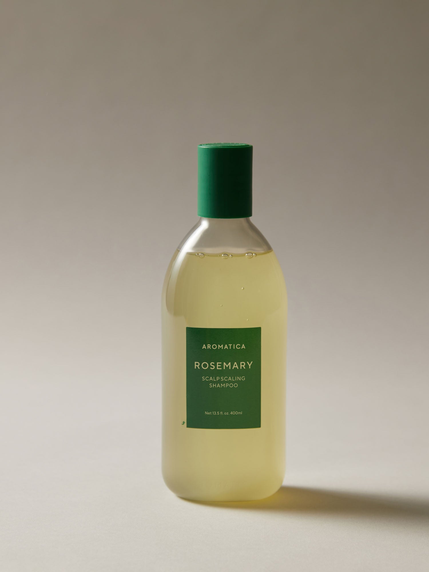Aromatica Rosemary Scalp Scaling Shampoo enriched with rosemary oil, biotin, panthenol, probiotics, and amino acids for healthy, nourished hair