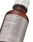 Close-up of Mary & May Multi Hyaluronic Serum packaging – Highlighting the sleek bottle design and emphasizing the six types of hyaluronic acid that lock in hydration and promote smooth, hydrated skin.