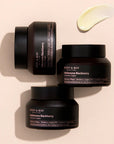 Close-up of Mary & May Idebenone + Blackberry Complex Intensive Total Care Cream packaging – Showing the sleek jar with the label highlighting its nourishing and antioxidant-rich formula for skin protection.