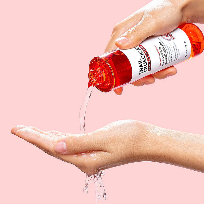 Some By Mi Snail Truecica Miracle Repair Toner – Close-up of the toner being applied with a cotton pad, showing its smooth and hydrating formula for repairing damaged skin.