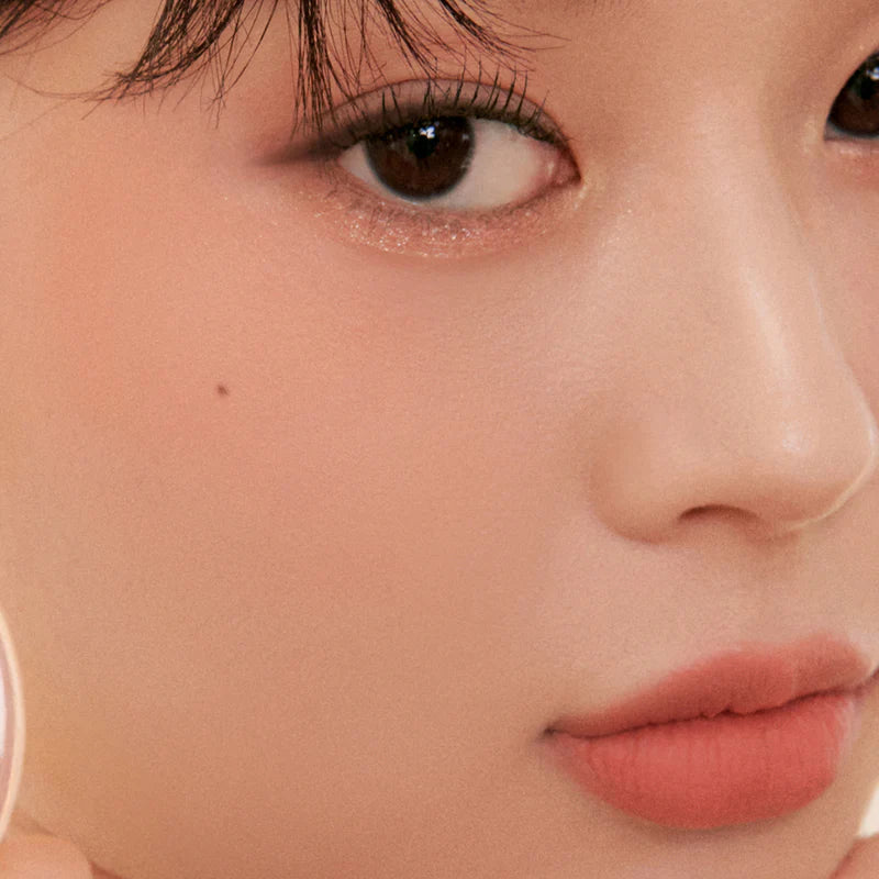 Close-up of the Peripera Pure Blushed Sunshine Cheek blush on the cheeks, highlighting the smooth, seamless application, and the radiant, matte finish that absorbs excess oil for long-lasting wear.