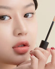 Peripera Double Longwear Cover Concealer being applied to areas of concern like dark circles and blemishes, showcasing its ability to blend seamlessly into the skin for a natural, flawless finish.