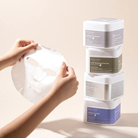 Close-up of Mary & May Niacinamide Vitamin C Brightening Mask sheet – The soft sheet mask with a smooth texture, enriched with brightening Niacinamide and hydrating Hyaluronic Acid.