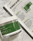 Neogen Bio Peel Gauze Peeling Green Tea container with visible cotton gauze pads soaked in green tea extract, showcasing the product’s gentle exfoliating properties.