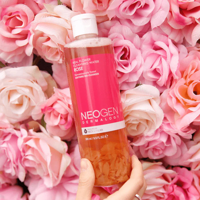 Neogen Real Flower Cleansing Water (Rose) (300 ml) featuring real rose petals floating in the bottle, emphasizing its hydrating and soothing properties for dry, sensitive skin.
