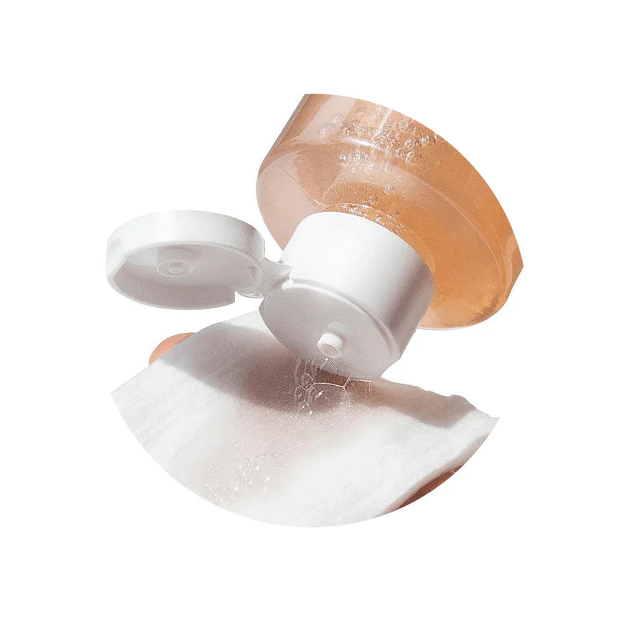 Neogen Real Flower Cleansing Water (Rose) (300 ml) featuring real rose petals floating in the bottle, emphasizing its hydrating and soothing properties for dry, sensitive skin.