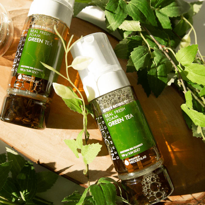 Neogen Dermalogy Real Fresh Foam Green Tea (160 ml), displayed with fresh green tea leaves and natural ingredients, highlighting its hydrating and soothing properties.