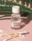 Neogen A Clear Soothing Pink Eraser bottle with visible pink sediment at the bottom, highlighting the soothing and acne-fighting properties of the treatment.