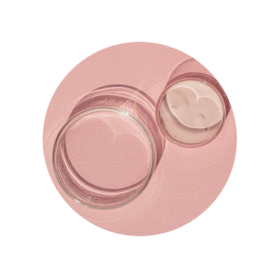 Neogen A Clear Soothing Pink Eraser bottle with visible pink sediment at the bottom, highlighting the soothing and acne-fighting properties of the treatment.