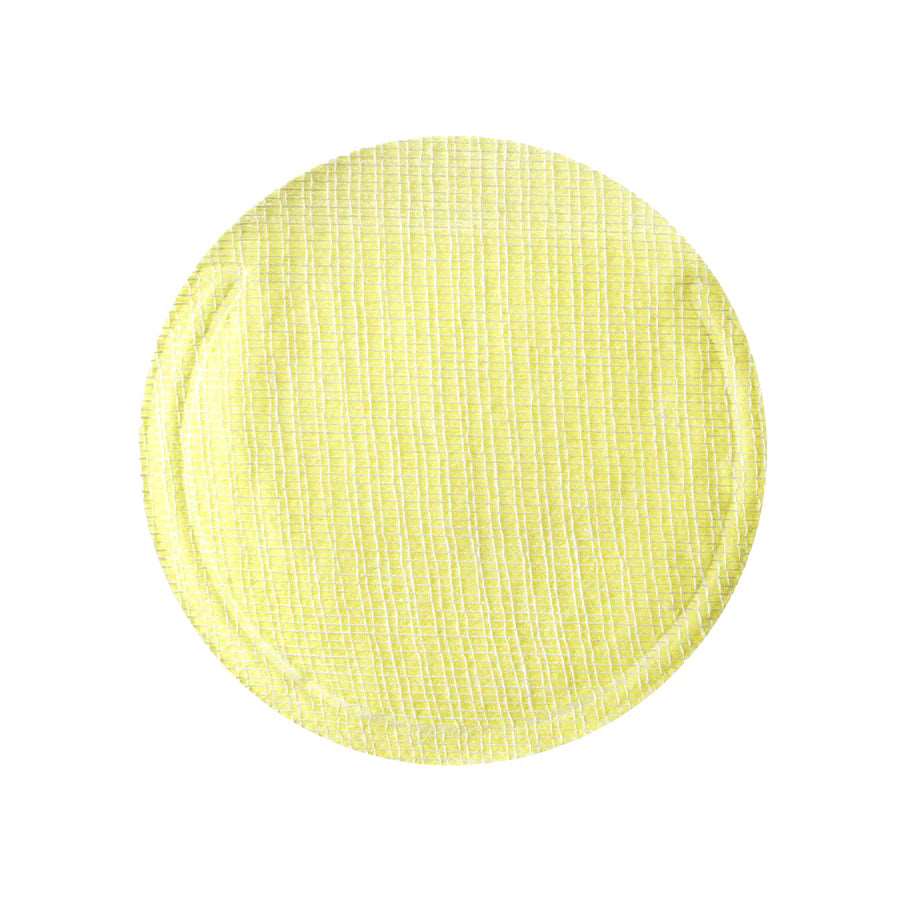 Close-up of a cotton gauze pad soaked in lemon serum, demonstrating its exfoliating texture while effectively removing dead skin cells and impurities.