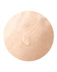 Person gently patting the essence into their skin with hands or a cotton pad, demonstrating how easily the essence absorbs and preps the skin for the next steps in the skincare routine.