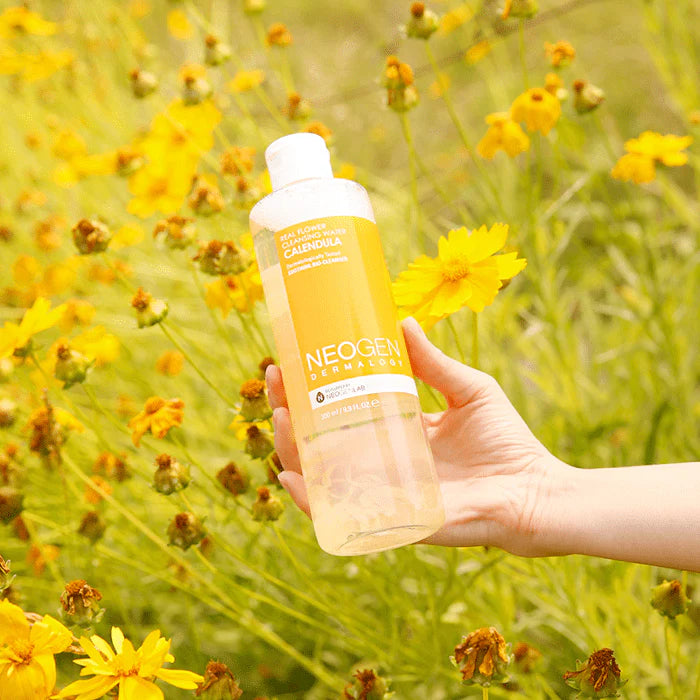 Neogen Real Flower Cleansing Water (Calendula) (300 ml) featuring real calendula petals floating inside the bottle, showcasing its gentle cleansing and soothing properties.