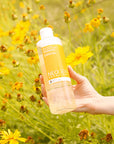 Neogen Real Flower Cleansing Water (Calendula) (300 ml) featuring real calendula petals floating inside the bottle, showcasing its gentle cleansing and soothing properties.
