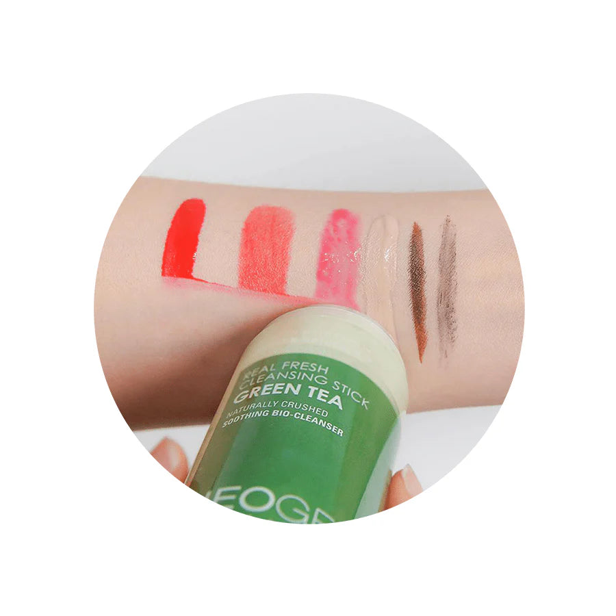 Person using Neogen Real Fresh Cleansing Stick Green Tea, massaging it in circular motions on the face for a gentle, natural cleanse.