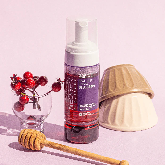 Neogen Dermalogy Real Fresh Foam Blueberry (150 ml) showing the sleek bottle with vibrant blueberry design, emphasizing its natural ingredients and gentle formula.