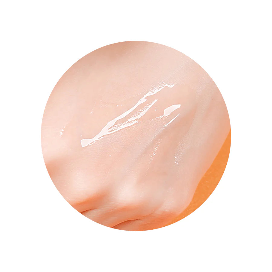 Close-up of the serum’s lightweight, silky texture being dispensed, showcasing its smooth, fast-absorbing consistency ideal for daily use on the skin.
