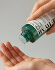 Some By Mi AHA BHA PHA 30 Days Miracle Toner – Clear toner applied on cotton pad for gentle exfoliation and acne control.