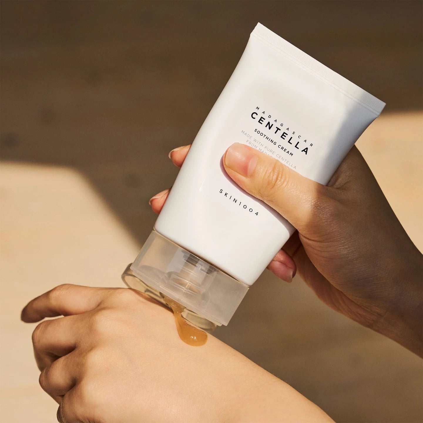 Applying SKIN1004 Madagascar Centella Soothing Cream – Gently massaging the soothing gel-cream into the skin for a cooling and hydrating effect.